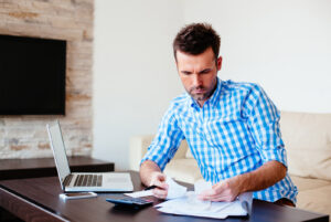man going over financials at desk
