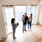 First-time condo buyers walking through a condo