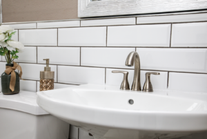 subway tile and pedestal sink