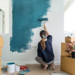 Homeowner painting a wall