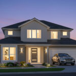 A house with lights on outside at night