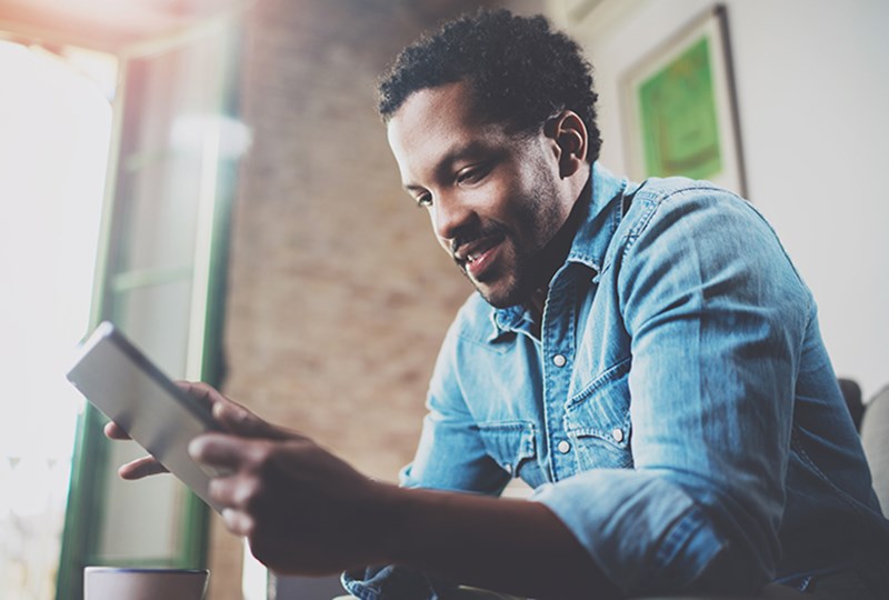 Man reading on his tablet